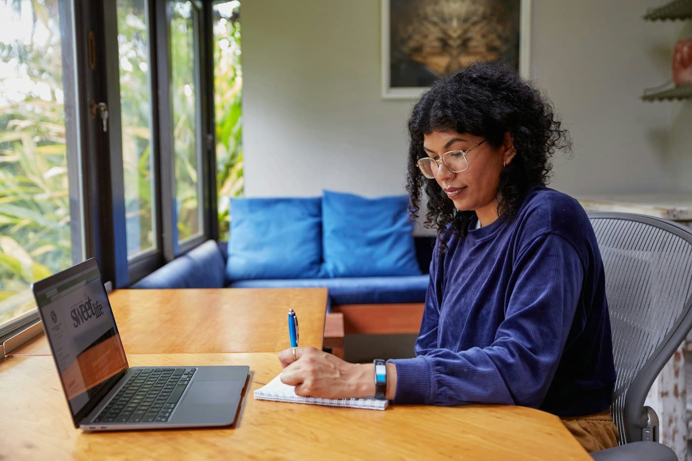 Designer reviewing a website layout on a laptop